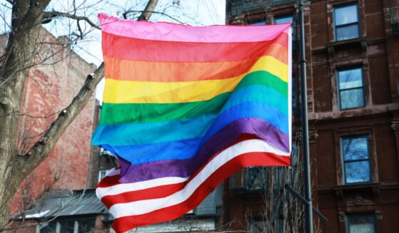 A "pride" flag flies in front of The American Flag at the Stonewall National Monument in New York City on Feb. 12, 2026.