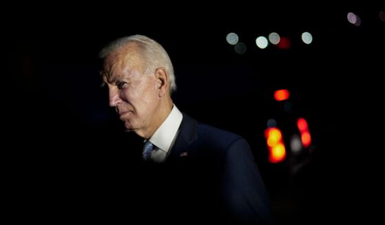 Then-Democratic presidential nominee Joe Biden talks with local firefighters as he leaves a CNN townhall in Moosic, Pennsylvania, on Sept. 17, 2020.