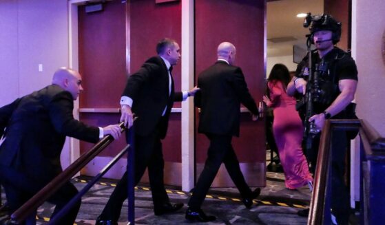 White House Deputy Chief of Staff for Policy Stephen Miller and his wife Katie Miller are escorted out of the annual White House Correspondents Association Dinner after a shooting occurred on April 25, 2026 in Washington, DC.