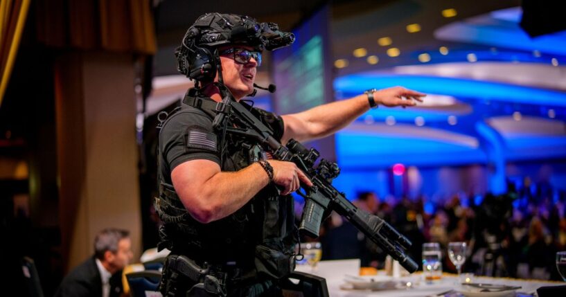 Armed Secret Service agents stand on stage at the annual White House Correspondents Association Dinner at the Washington Hilton in Washington, DC after a shooting took place on April 25, 2026.