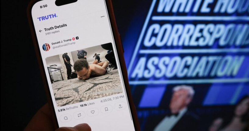 A hand holds a phone with a photo of Cole Tomas Allen, the man accused of attempting to murder President Donald Trump and other administration officials. at the White House Correspondents' dinner on April 25, 2026 in Washington, DC.
