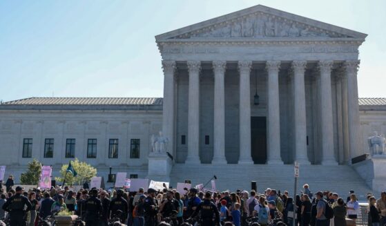 Protesters gather outside the Supreme Court building on April 27, 2026.