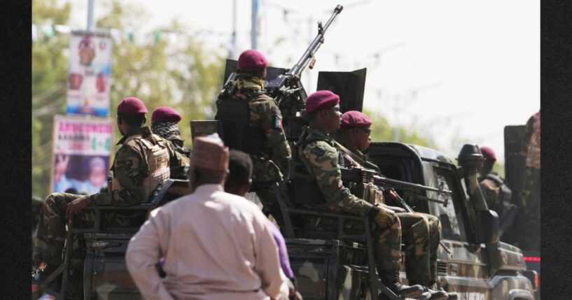 Soldiers patrol the streets in northern Nigeria in a file photo from Feb. 13. More thanr 25 people were killed over Easter weekend during several attacks in Nigeria.