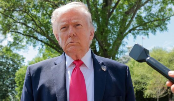 President Donald Trump speaks to the media Thursday before boarding Marine One on the South Lawn of the White House.