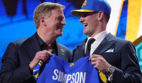 Alabama quarterback Ty Simpson poses with NFL Commissioner Roger Goodell after being chosen by the Los Angeles Rams with the 13th overall pick during the first round of the NFL football draft, Thursday in Pittsburgh, Pennsylvania. Due to "embarrassing" blunders, viewers on social media knew of Simpson's pick long before those watching ESPN.
