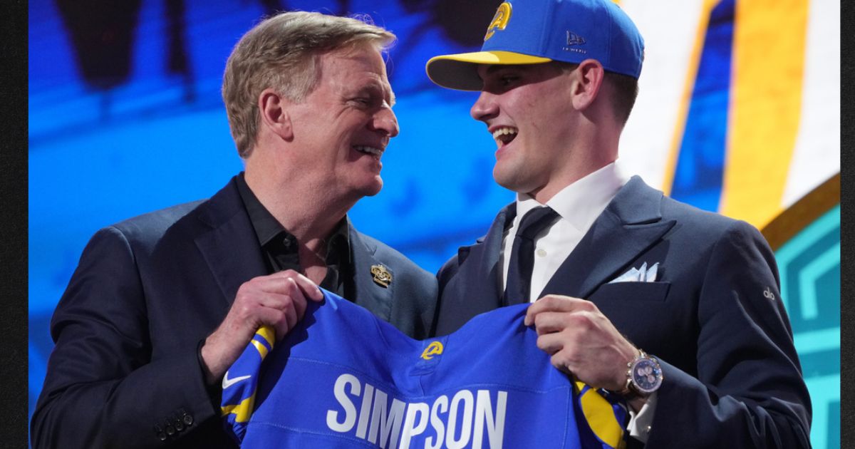 Alabama quarterback Ty Simpson poses with NFL Commissioner Roger Goodell after being chosen by the Los Angeles Rams with the 13th overall pick during the first round of the NFL football draft, Thursday in Pittsburgh, Pennsylvania. Due to "embarrassing" blunders, viewers on social media knew of Simpson's pick long before those watching ESPN.