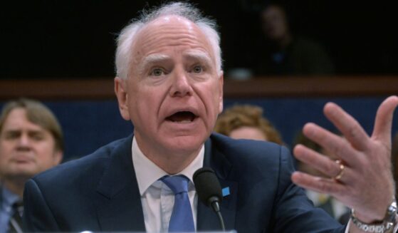 Minnesota Gov. Tim Walz, seen in a March 4 photo, tried to take partial credit for the raid, only to get called out by those who recall what actually happened.