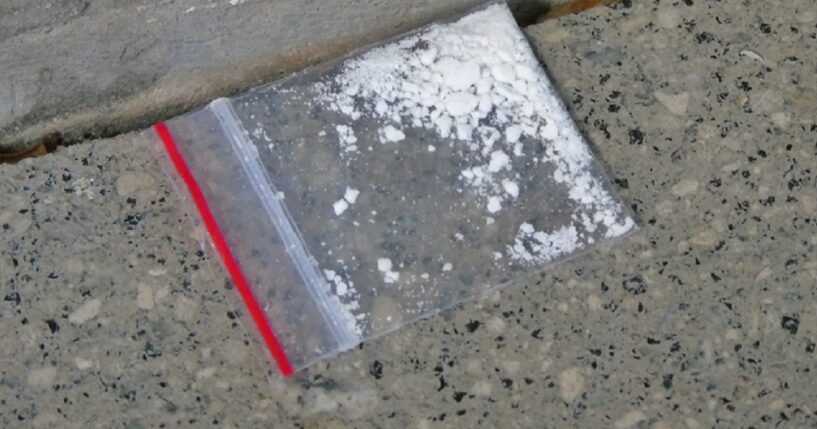 A stock photo shows a small amount of cocaine in a Ziploc baggie.