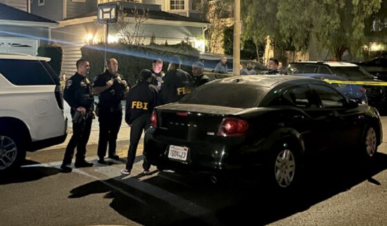 Torrance, California, gather Saturday night near a home linked to Cole Tomas Allen.