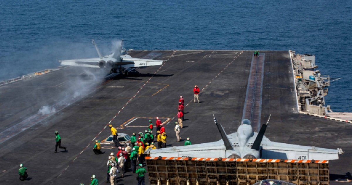 An F/A-18E Super Hornet prepares to launch from the flight deck of the USS Abraham Lincoln at the beginning of Operation Epic Fury, the attack on Iran, on Feb 28.