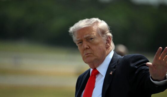 President Donald Trump waves after his arrival at Ocala International Airport, in Ocala, Florida, on May 1, 2026.