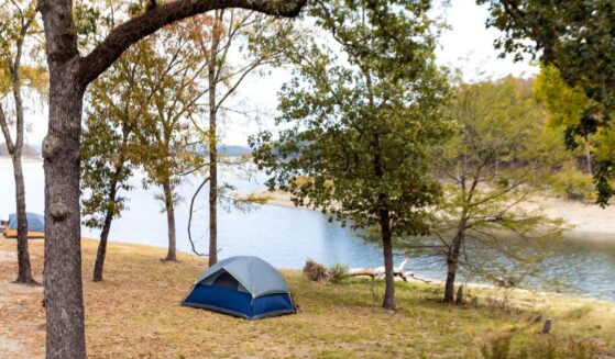 Camping tents near a beautiful lake among trees at Broken Bow Lake in Oklahoma.