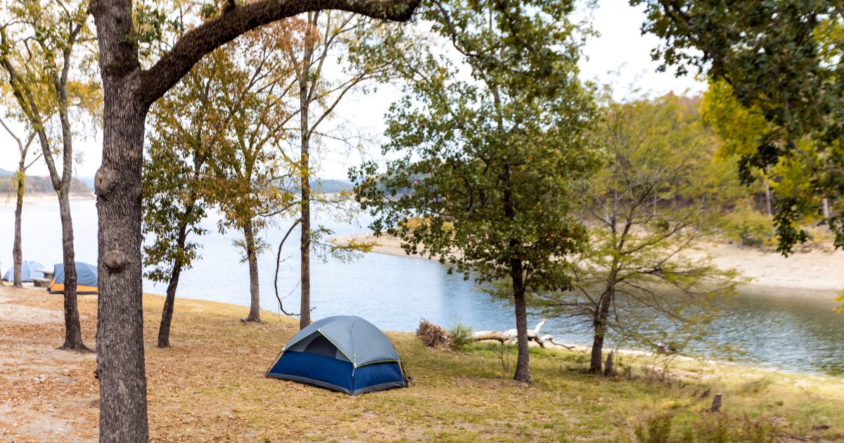 Camping tents near a beautiful lake among trees at Broken Bow Lake in Oklahoma.