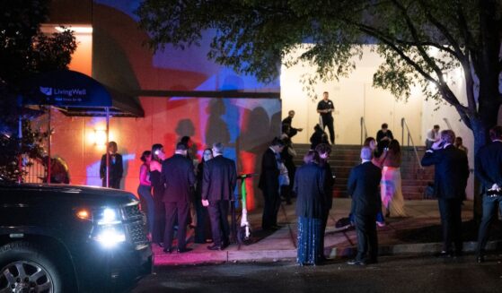 Guests evacuate the Washington Hilton during the White House Correspondents' Dinner after gunshots rang out on April 25, 2026, in Washington, D.C.