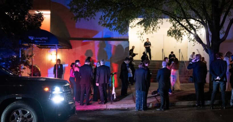 Guests evacuate the Washington Hilton during the White House Correspondents' Dinner after gunshots rang out on April 25, 2026, in Washington, D.C.
