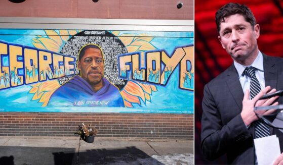 Minneapolis Mayor Jacob Frey, right, chose to honor George Floyd, whose image at left is depicted in a mural at the city's George Floyd Square, on Memorial Day.