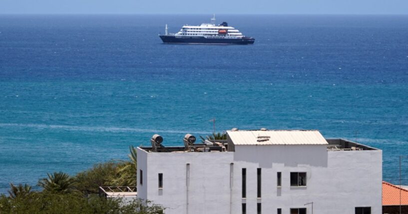 The MV Hondius cruise ship remained anchored Monday at a port in Praia, Cape Verde, off the west coast of Africa.