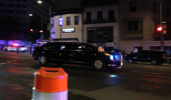 A vehicle of a motorcade flees into the night after the White House Press Correspondents’ Dinner incident.