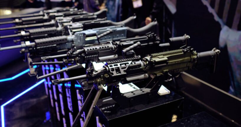 Rows of rifles sit at a gun expo on May 8, 2026.