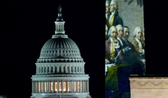 The United States Capitol Building flanks the Washington Monument on December 31, 2025.