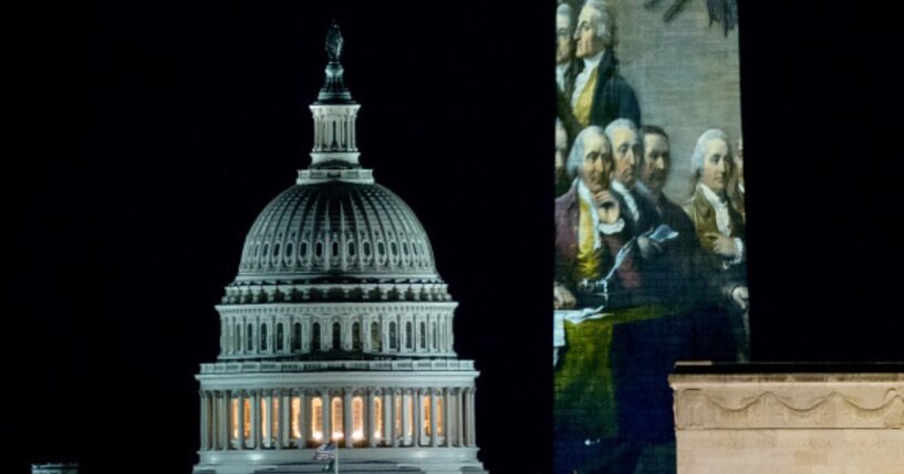 The United States Capitol Building flanks the Washington Monument on December 31, 2025.