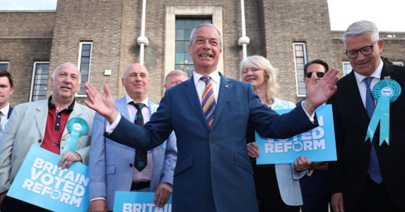 Nigel Farage stands outside a council building celebrating Reform UK's historic local election victory on May 8, 2026.