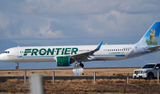 A Frontier plane can be seen as it taxis down the runway preparing for takeoff on November 25, 2025.