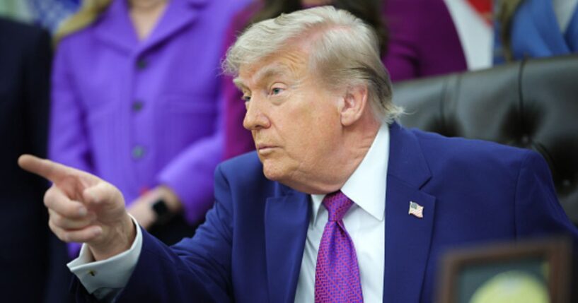 President Donald Trump sits in the Oval Office during his maternal healthcare announcement on May 11, 2026.