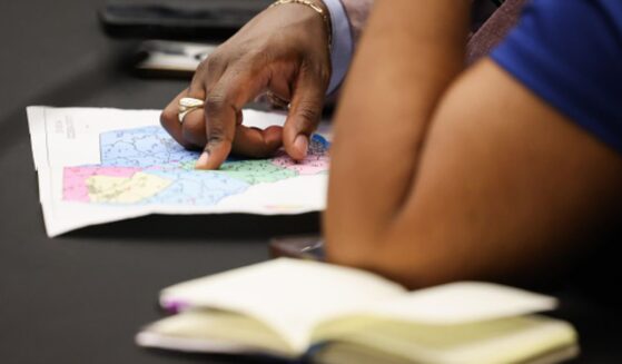 Two women examine the newly redrawn map for South Carolina on May 8, 2026.