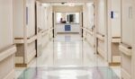 A hospital hallway stands empty.