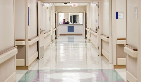 A hospital hallway stands empty.