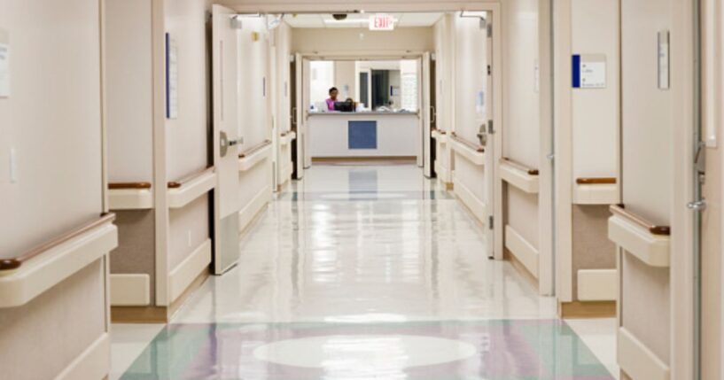 A hospital hallway stands empty.