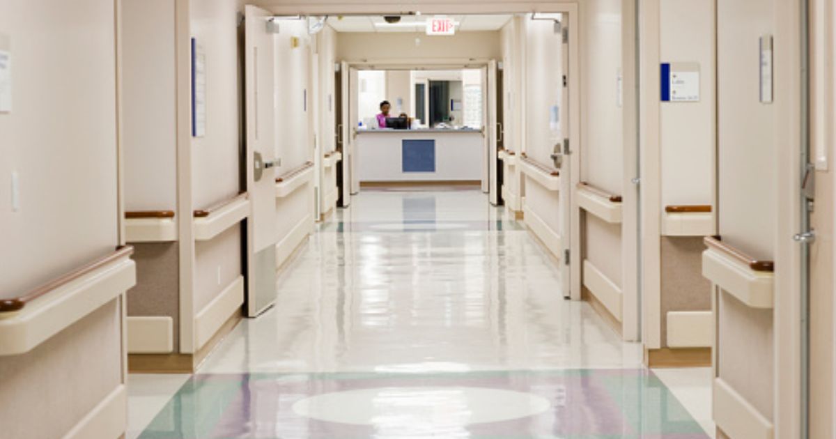 A hospital hallway stands empty.