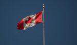 The Canadian flag flies in Montreal, Quebec, Canada.