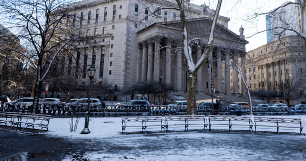 The New York Supreme Court is surrounded by cars on a snowy day on January 19, 2026.