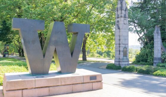 A statue showcasing the University of Washington’s emblem stands in the center of a paved walkway on the campus on June 15, 2023.