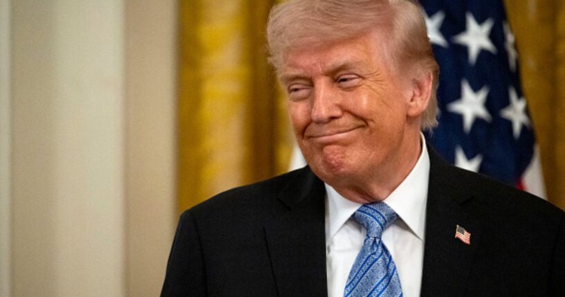 President Trump stands and smiles in the East Room in the White House on May 4, 2026.