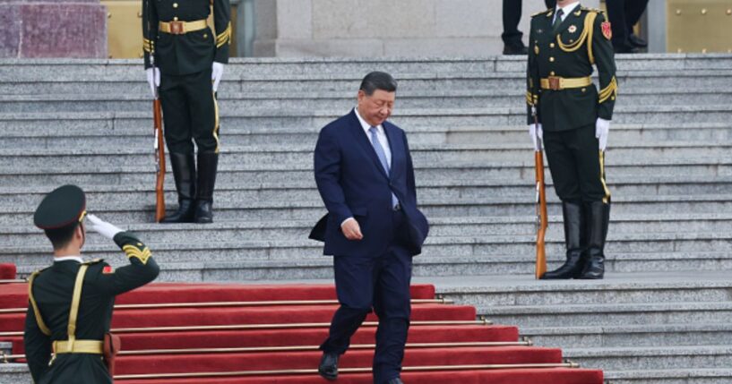 President Xi Jinping walks down the stairs of the Great Hall of the People on May 12, 2026 in Beijing, China.