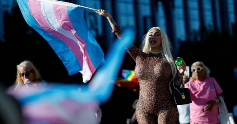 The transgender flag waves as a participant of the 21st San Francisco Annual Trans March holds it while screaming on June 27, 2025.