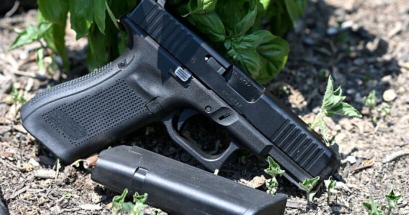 A gun is photographed as it lays on the ground in Richmond, Virginia on July 7, 2021.