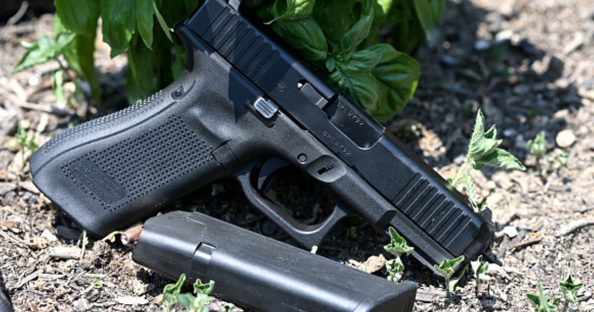 A gun is photographed as it lays on the ground in Richmond, Virginia on July 7, 2021.