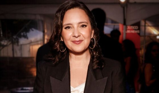 Bari Weiss is pictured smiling at a dinner reception.
