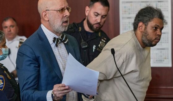 Randy Santos is humped over in a New York City Courtroom as an accompanying attorney argues to the court on May 28, 2026.