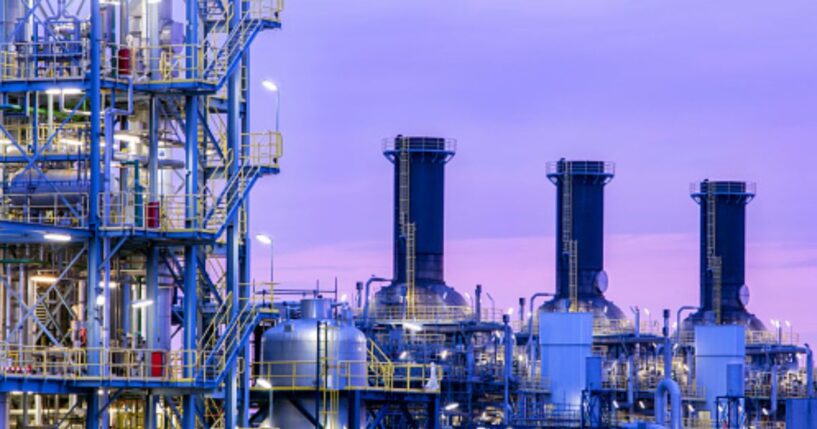 A chemical plant operates as dusk falls.