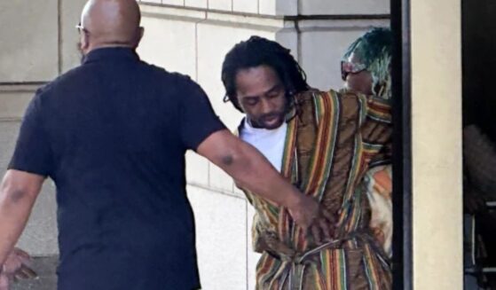 DC Councilman Trayon White Sr. is escorted out of the federal courthouse on August 19, 2024.