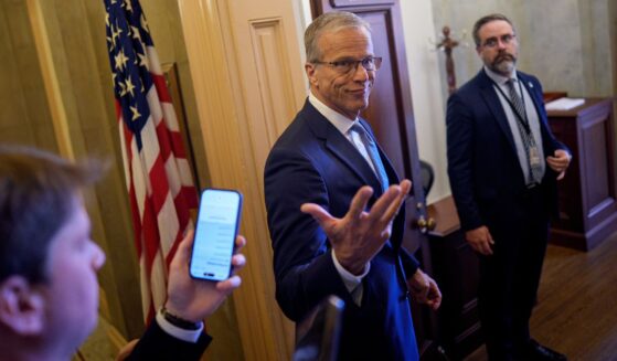 Senate Majority Leader John Thune, a South Dakota Republican, gestures pauses to speak to reporters Thursday as he walks into his office at the U.S. Capitol Building in Washington, D.C.
