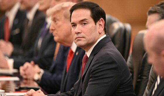 Secretary of State Marco Rubio looks on Thursday as President Donald Trump meets with China's President Xi Jinping at the Great Hall of the People in Beijing.