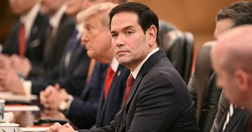 Secretary of State Marco Rubio looks on Thursday as President Donald Trump meets with China's President Xi Jinping at the Great Hall of the People in Beijing.