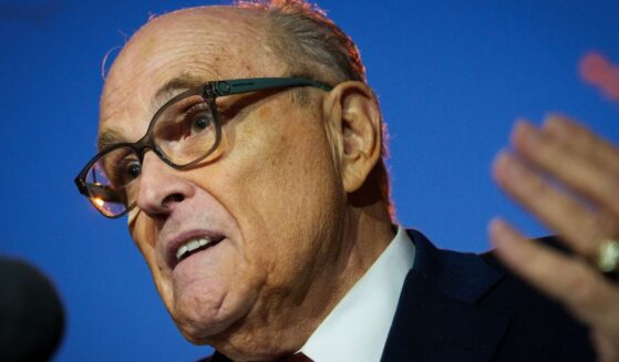 Rudy Giuliani gestures while speaking to reporters outside the E. Barrett Prettyman Courthouse on Dec. 11, 2023 in Washington, DC.