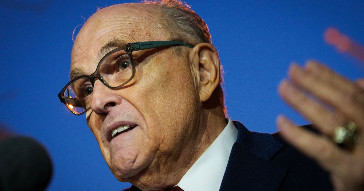 Rudy Giuliani gestures while speaking to reporters outside the E. Barrett Prettyman Courthouse on Dec. 11, 2023 in Washington, DC.